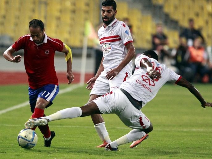 Al-Ahly's player Walid Souliman (RL fights for the ball with Zamalek's Marouf Youssef (R) during the Final soccer match of the Egyptian Cup 2010 between Al-Ahly and Zamalek at Borg Al Arab Stadium in Alexandria , Egypt, 08 August 2016.