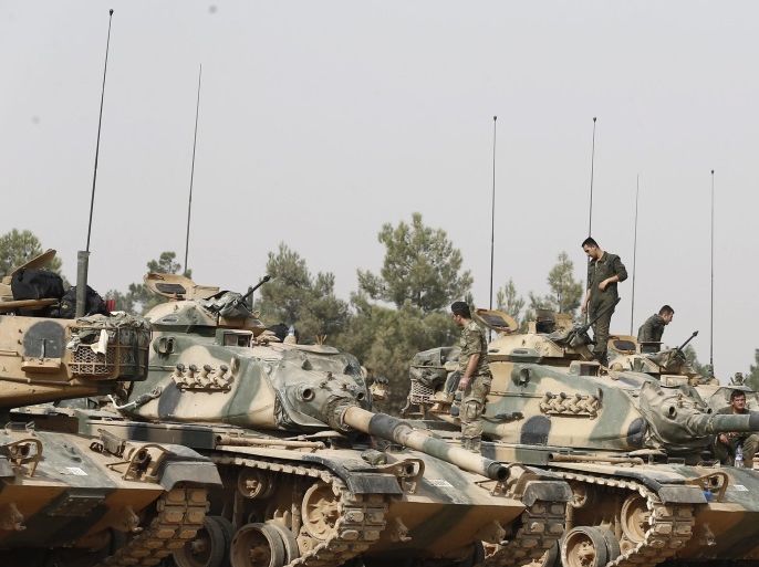 Turkish soldiers stand on tanks as they prepare for a military operation at the Syrian border as part of their offensive against the so-called Islamic State (ISIS or IS) militant group in Syria, in Karkamis district of Gaziantep, Turkey, 25 August 2016. The Turkish army launched an offensive operation against ISIS in Syria's Jarablus with its war jets and army troops in coordination with the US led coalition war planes.