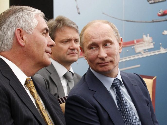 (FILE) A file picture dated 15 June 2012 shows Russian President Vladimir Putin (R), Krasnodar region Governor Alexander Tkachev (C) and ExxonMobil Chairman and CEO Rex Tillerson (L) attend a ceremony of signing an agreement between Rosneft and ExxonMobil on joint development of hard-to-access reserves in western Siberia at the Tuapse Refinery in Tuapse, Krasnodar region, Russia. According to reports from 10 December 2016, Tillerson is tipped the top candidate for US Se