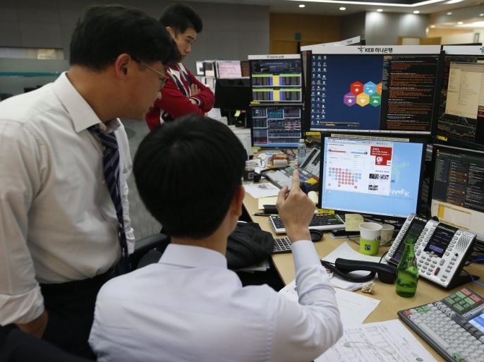 South Korean dealers work in front of monitors at the KEB Hana Bank in Seoul, South Korea, 09 November 2016. The benchmark South Korea Composite Stock Price Index (KOSPI) fell by 45.00 points to 1,958.38 in response to the US presidential elections.