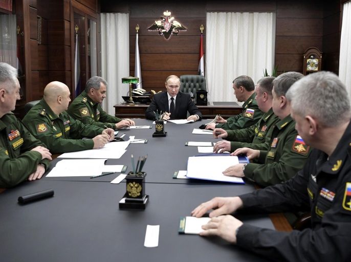 Russian President Vladimir Putin, Defence Minister Sergei Shoigu and chief of Russia's General Staff Valery Gerasimov attend a meeting with top military officials at the Defence Ministry in Moscow, Russia December 22, 2016. Sputnik/Kremlin/Alexei Nikolskyi via REUTERS ATTENTION EDITORS - THIS IMAGE WAS PROVIDED BY A THIRD PARTY. EDITORIAL USE ONLY.