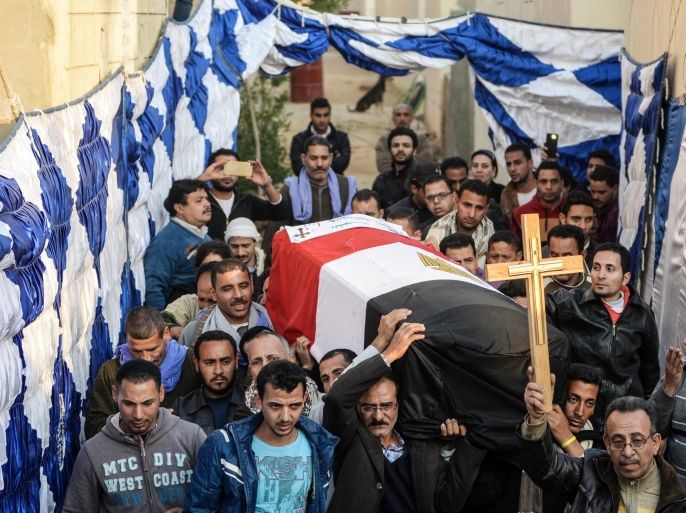 epaselect epa05672748 People carry a coffin as relatives of the victims of the Coptic Christian cathedral complex bomb attack mourn during the burial service, Cairo, Egypt, 12 December 2016. Egyptian President Abdel Fattah al-Sisi announced that 22-year-old suicide bomber named 'Mahmoud Shafiq Mohamed Mostafa' is responsible for the attack that killed 24 people and 35 injured on 11 December 2016 in St. Peter and St. Paul Coptic Orthodox Church, a small chapel attached