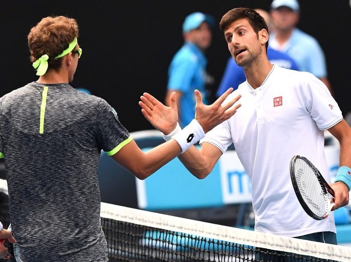 Denis Istomin of Uzbekistan (L) is congratulated by Novak Djokovic of Serbia (R) after Istomin defeated Djokovic during round two of the Men’s Singles at the Australian Open Grand Slam tennis tournament in Melbourne, Victoria, Australia, 19 January 2017. EPA/DEAN LEWINS AUSTRALIA AND NEW ZEALAND OUT