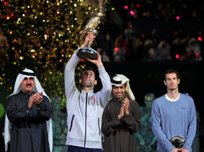 Tennis - Qatar Open - Men's singles final - Andy Murray of Britain v Novak Djokovic of Serbia - Doha, Qatar - 7/1/2017 - Djokovic holds the trophy. REUTERS/Naseem Zeitoon TPX IMAGES OF THE DAY