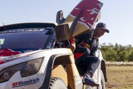French driver Stephane Peterhansel of Peugeot celebrates his first place in the car category at the end of the 12th stage of the Rally Dakar 2017 in Rio Cuarto, Argentina, 14 January 2017.