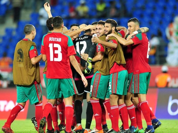 Moroccan players celebrate after the 2017 Africa Cup of Nations group C soccer match between Morocco and Ivory Coast in Oyem, Gabon, 24 January 2017. Morocco won 1-0.