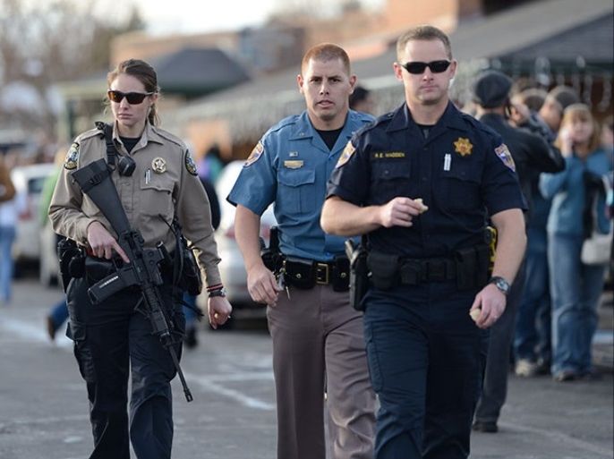 epa03989865 Local law enforcement patrol the area near Arapahoe High School in Denver, Colorado, USA following a shooting incident there 13 December, 2013. An unidentified student fired on fellow students critically injuring one. The gunman then killed himself. EPA/BOB PEARSON