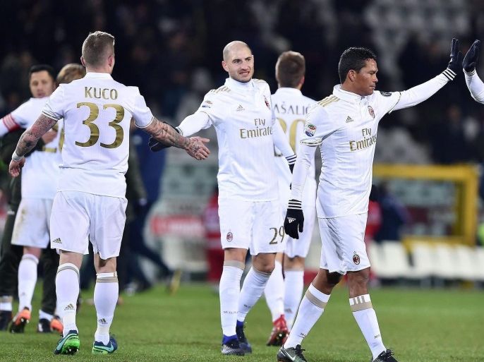 Milan's players celebrate at the end of the Italian Serie A soccer match Torino FC vs AC Milan at Olimpico stadium in Turin, Italy, 16 January 2017.