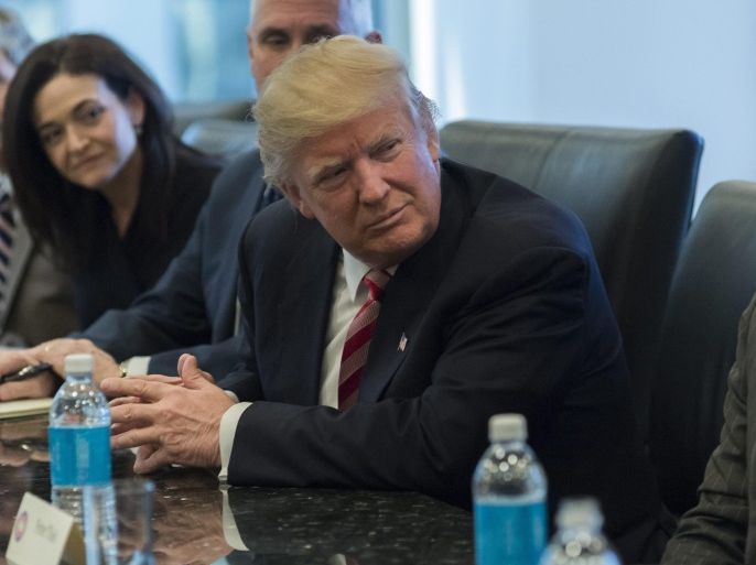 US President-elect Donald Trump (R) attends a meeting of technology chiefs in the Trump Organization conference room at Trump Tower in New York, New York, USA, 14 December 2016.