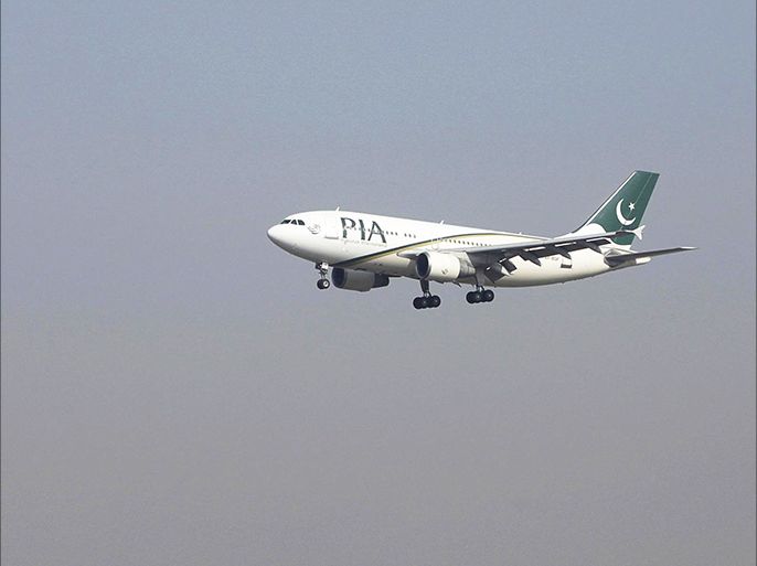 FILE PHOTO - A Pakistan International Airlines (PIA) passenger plane arrives at the Benazir International airport in Islamabad, Pakistan December 2, 2015. REUTERS/Faisal Mahmood/File Photo