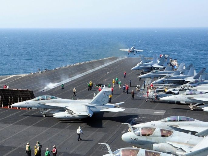 A handout picture made available by the US Department of Defense (DOD) shows an arcraft launching from the flight deck of the aircraft carrier USS George H.W. Bush (CVN 77) at sea in the Arabian Gulf, 13 October 2014. George H.W. Bush is supporting maritime security operations, strike operations in Iraq and Syria as directed, and theater security cooperation efforts in the US 5th Fleet area of responsibility. The coalition fighting Islamic State (IS or ISIS) militants i