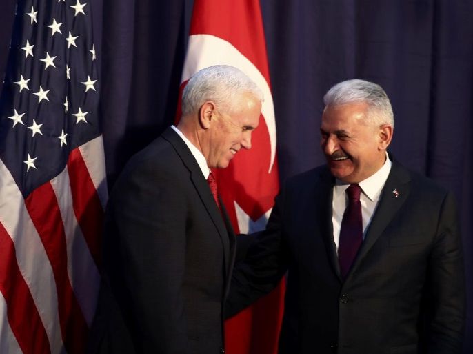 U.S. Vice President Mike Pence and Turkish Prime Minister Binali Yildirim pose for a picture before their meeting at the 53rd Munich Security Conference in Munich, Germany, February 18, 2017. REUTERS/Michael Dalder