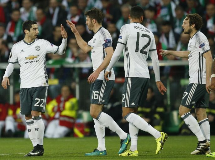 Soccer Football - Saint-Etienne v Manchester United - UEFA Europa League Round of 32 Second Leg - Stade Geoffroy-Guichard, Saint-Etienne, France - 22/2/17 Manchester United's Henrikh Mkhitaryan celebrates scoring their first goal with Michael Carrick Action Images via Reuters / Andrew Boyers Livepic
