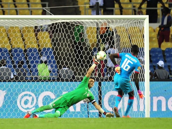Essam El Hadary of Egypt saves a penalty of Herve Koffi of Burkina Faso during the 2017 Africa Cup of Nations semi final match between Burkina Faso and Egypt at the Libreville Stadium in Gabon on 01 February 2017.