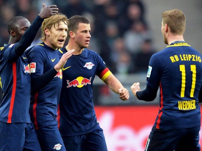 Leipzig's Emil Forsberg (2-L) celebrates with his teammates after scoring the 1-0 lead during the German Bundesliga soccer match between Borussia Moenchengladbach and RB Leipzig in Moenchengladbach, Germany, 19 February 2017. EPA/SASCHA STEINBACH EMBARGO CONDITIONS - ATTENTION: Due to the accreditation guidelines, the DFL only permits the publication and utilisation of up to 15 pictures per match on the internet and in online media during the match.