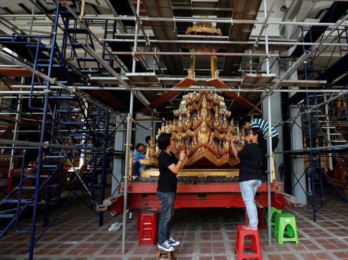 Thai officials from the Conservation Science Division of the Fine Arts Department of the National Museum of Thailand repairs the Minor Chariot, which will be used during the late King Bhumibol Adulyadej's funeral later this year, Thailand, February 6, 2017. Picture Taken February 6, 2017. REUTERS/Chaiwat Subprasom