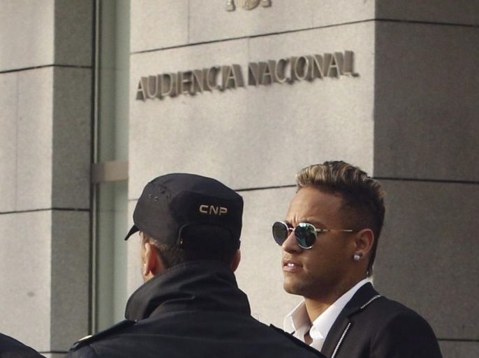 (FILE) A file picture dated 02 February 2016 shows Barcelona's FC player Brazilian Neymar JR (R) arriving to the Audiencia Nacional court in Madrid, Spain. Neymar JR attended court in Madrid on 07 June 2016 to appear before the judge regarding the allegations of tax fraud in his transfer from Santos to FC Barcelona back in 2013. The General Attorney has demanded, 07 June 2016, to take Neymar and his father to trial.