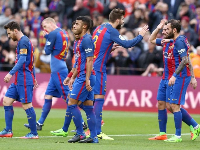 FC Barcelona's forward Fancisco Alcacer (R, behind) celebrates with his teammates after scoring the 1-0 against Athletic Club during their Spanish Primera Division league game at Camp Nou stadium in Barcelona, northeastern Spain, 04 February 2017.
