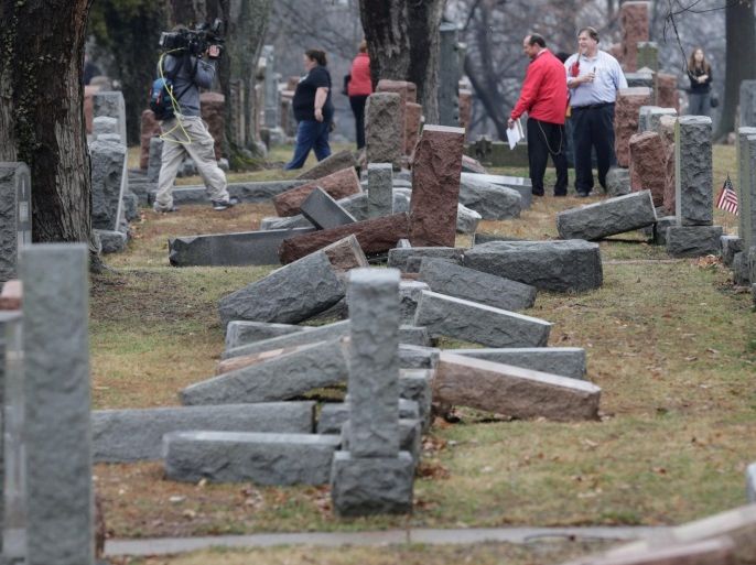 Local and national media report on more than 170 toppled Jewish headstones after a weekend vandalism attack on Chesed Shel Emeth Cemetery in University City, a suburb of St Louis, Missouri, U.S. February 21, 2017. REUTERS/Tom Gannam