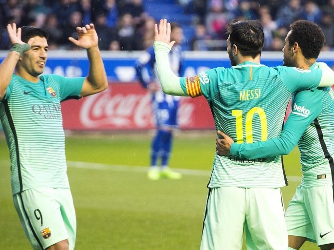 FC Barcelona's Uruguayan striker Luis Suarez (L) jubilates with Neymar (R) and Leo Messi (C) his goal against UD Alaves during their Primera Division soccer match played at Mendizorroza stadium in Vitoria, Basque Country, Spain on 11 February 2017.