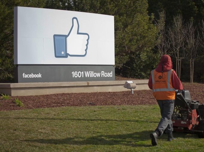 (FILE) - A file photo dated 31 January 2012 showing a grounds keeper mowing the lawn in front of Facebook's new Corporate headquarters in Menlo Park, California, USA. Facebook is to report its 4th quarter 2016 earnings on 01 February 2017.
