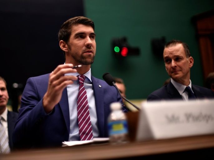 Olympic gold medalist Michael Phelps testifies before the House Oversight and Investigations Subcommittee about anti-doping policy in international sport as U.S. Anti-Doping Agency CEO Travis Tygart (R) looks on in Washington February 28, 2017. REUTERS/James Lawler Duggan