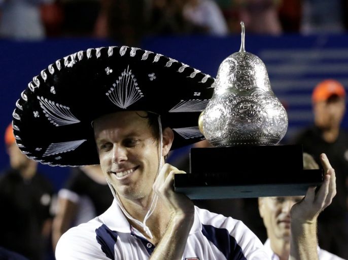 Tennis - Mexican Open - Men's Singles - Final - Acapulco, Mexico- 04/03/17. USA's Sam Querrey holds up the trophy after winning his final match against Spain's Rafael Nadal. REUTERS/Henry Romero