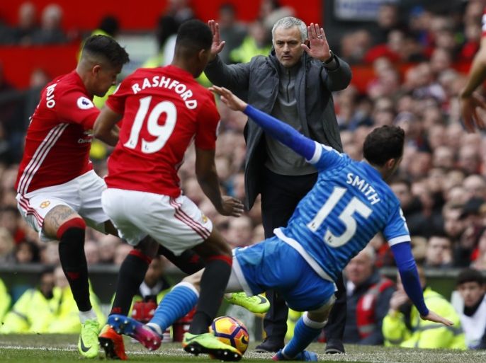 Britain Soccer Football - Manchester United v AFC Bournemouth - Premier League - Old Trafford - 4/3/17 Bournemouth's Adam Smith in action with Manchester United's Marcus Rashford and Marcos Rojo as manager Jose Mourinho looks on Action Images via Reuters / Jason Cairnduff Livepic EDITORIAL USE ONLY. No use with unauthorized audio, video, data, fixture lists, club/league logos or
