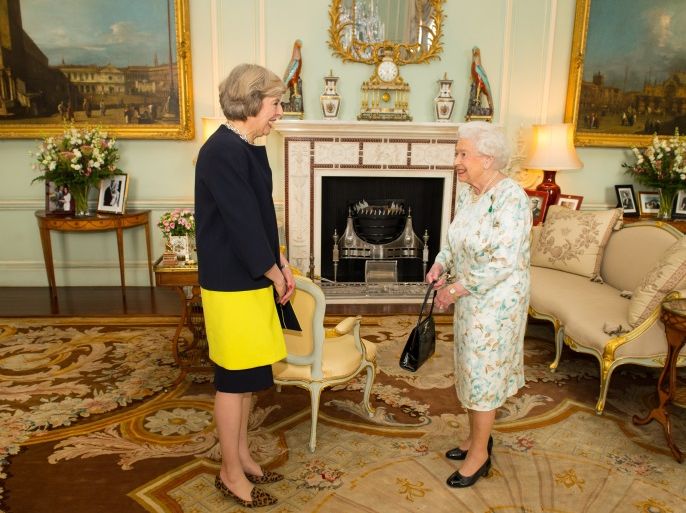 LONDON, ENGLAND - JULY 13: Queen Elizabeth II welcomes Theresa May at the start of an audience where she invited the former Home Secretary to become Prime Minister and form a new government at Buckingham Palace on July 13, 2016 in London, England. Former Home Secretary Theresa May becomes the UK's second female Prime Minister after she was selected unopposed by Conservative MPs to be their new party leader. She is currently MP for Maidenhead. (Photo by Dominic Lipins