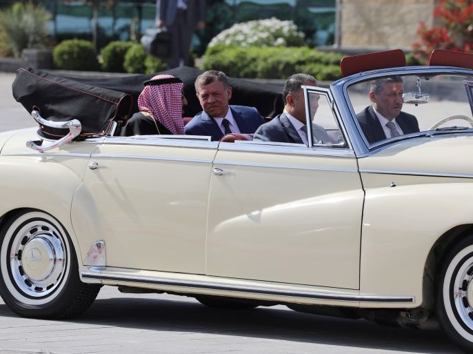Jordan's King Abdullah II and Saudi Arabia's King Salman bin Abdulaziz Al Saud sit an a car during a welcoming ceremony at the airport in Amman, Jordan March 27, 2017. REUTERS/Ammar Awad