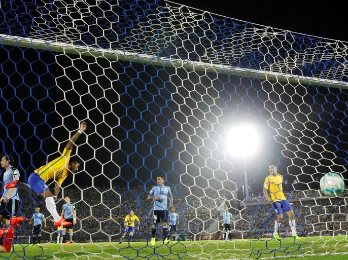Football Soccer - Uruguay v Brazil - World Cup 2018 Qualifiers - Centenario stadium, Montevideo, Uruguay - 23/3/17 - Brazil's Paulinho (3rd L) scores his second goal. REUTERS/Andres Stapff