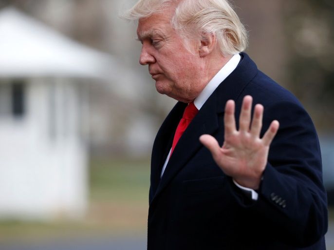 U.S. President Donald Trump waves as he walks from Marine One upon his return to the White House in Washington, U.S., March 19, 2017. REUTERS/Joshua Roberts