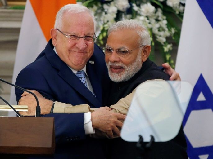 Israeli President Reuven Rivlin and India's Prime Minister Narendra Modi hug each other after reading their joint statement at Hyderabad House in New Delhi, India, November 15, 2016. REUTERS/Adnan Abidi TPX IMAGES OF THE DAY