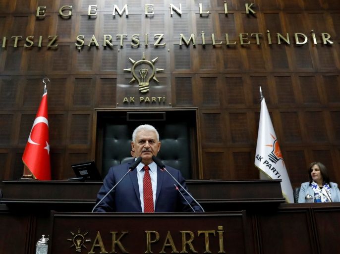 Turkey's Prime Minister Binali Yildirim addresses members of parliament from his ruling AK Party (AKP) during a meeting at the Turkish parliament in Ankara, Turkey, April 18, 2017. REUTERS/Umit Bektas