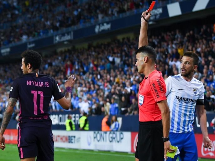 MALAGA, SPAIN - APRIL 08: Neymar Jr. of FC Barcelona is shown a red card during the La Liga match between Malaga CF and FC Barcelona at La Rosaleda stadium on April 8, 2017 in Malaga, Spain. (Photo by David Ramos/Getty Images)