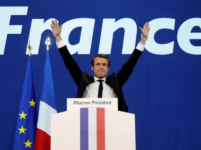 Emmanuel Macron, head of the political movement En Marche !, or Onwards !, and candidate for the 2017 French presidential election, celebrates after partial results in the first round of 2017 French presidential election, at the Parc des Expositions hall in Paris, France April 23, 2017. REUTERS/Benoit Tessier TPX IMAGES OF THE DAY
