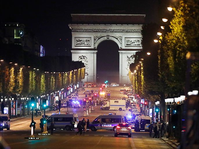 epa05918386 French Police officers after a shooting in which two police officer were killed along with their attacker and another police officer wounded in a terror attack near the Champs Elysees in Paris, France, 20 April 2017. Three police officers were shot on the avenue boulevard, according to reports with their suspected attacker killed by security forces. EPA/IAN LANGSDON
