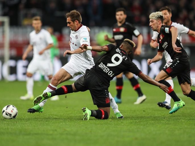 LEVERKUSEN, GERMANY - APRIL 15: Philipp Lahm of Bayern (L) and Leon Bailey of Leverkusen battle for the ball during the Bundesliga match between Bayer 04 Leverkusen and Bayern Muenchen at BayArena on April 15, 2017 in Leverkusen, Germany. (Photo by Maja Hitij/Bongarts/Getty Images)
