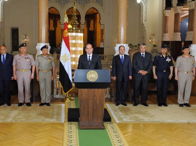 Egyptian President Abdel Fattah al-Sisi (C) gives an address after the gunmen attack in Minya, as he is flanked by leaders of the Supreme Council of the Armed Forces and the Supreme Council for Police at the Ittihadiya presidential palace in Cairo, Egypt, May 26, 2017 in this handout picture courtesy of the Egyptian Presidency. The Egyptian Presidency/Handout via REUTERS ATTENTION EDITORS - THIS IMAGE WAS PROVIDED BY A THIRD PARTY. EDITORIAL USE ONLY.