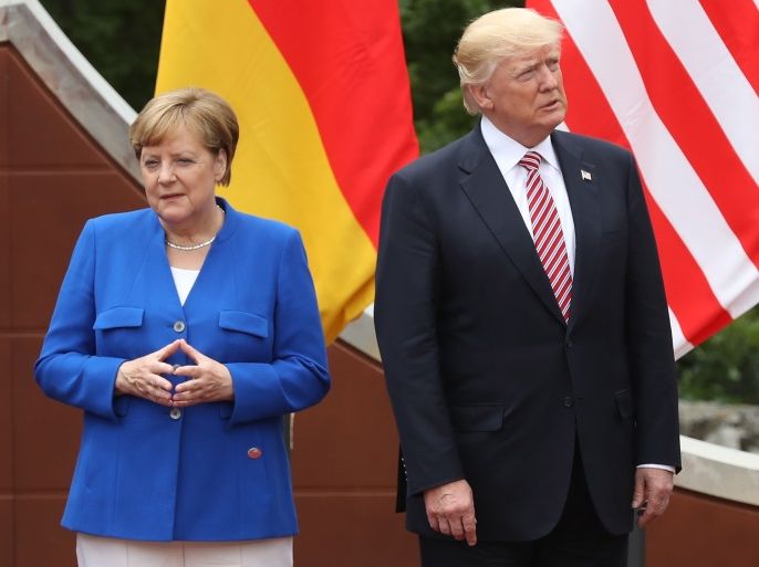 TAORMINA, ITALY - MAY 26: (From L to R) German Chancellor Angela Merkel, U.S. President Donald Trump and Italian Prime Minister Paolo Gentiloni arrive for the group photo at the G7 Taormina summit on the island of Sicily on May 26, 2017 in Taormina, Italy. Leaders of the G7 group of nations, which includes the Unted States, Canada, Japan, the United Kingdom, Germany, France and Italy, as well as the European Union, are meeting at Taormina from May 26-27. (Photo by Sean Gallup/Getty Images)