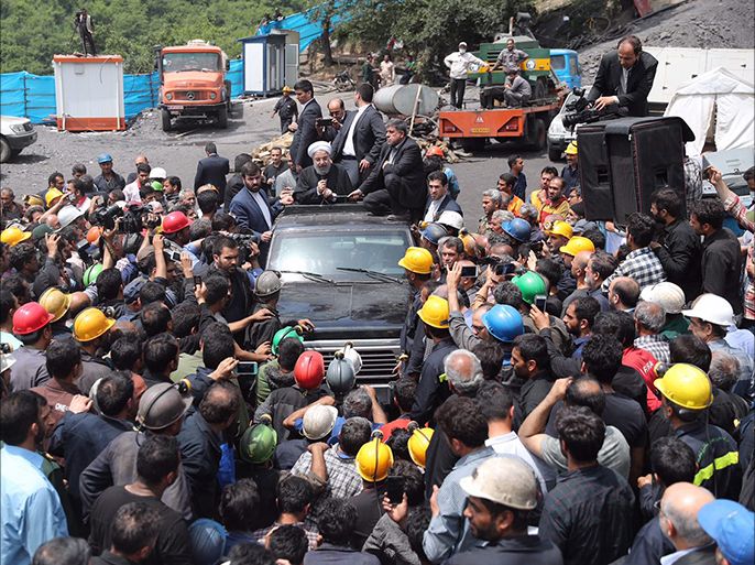 epa05948177 A handout photo made available by the presidential official website shows Iranian President Hassan Rouhani (C, on vehicle) talking with mine workers as he visits the Azadshahr coal mine in the city of Golestan, northern Iran, 07 May 2017.Media reported that about 35 mine workers died in an explosion in the mine on 03 May 2017. EPA/PRESIDENTIAL OFFICIAL WEBSITE HANDOUT HANDOUT EDITORIAL USE ONLY/NO SALES