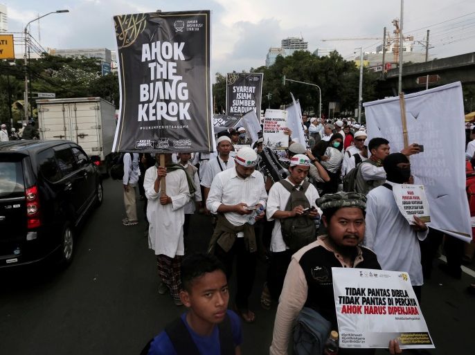Indonesia hardline Muslim group members protest to call for maximum punishment to be imposed on Jakarta governor Basuki