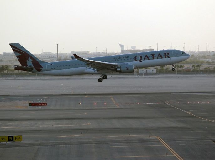 A Qatar Airways plane is seen at Hamad International Airport in Doha, Qatar June 12, 2017. REUTERS/Naseem Zeitoon