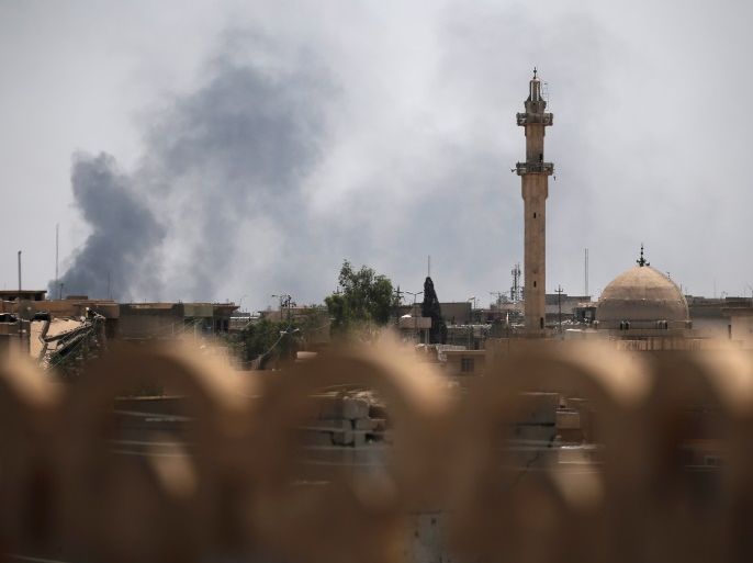 Smoke billows from the positions of the Islamic State militants after an artillery attack by the Iraqi forces in western Mosul, Iraq June 19, 2017. REUTERS/Alkis Konstantinidis