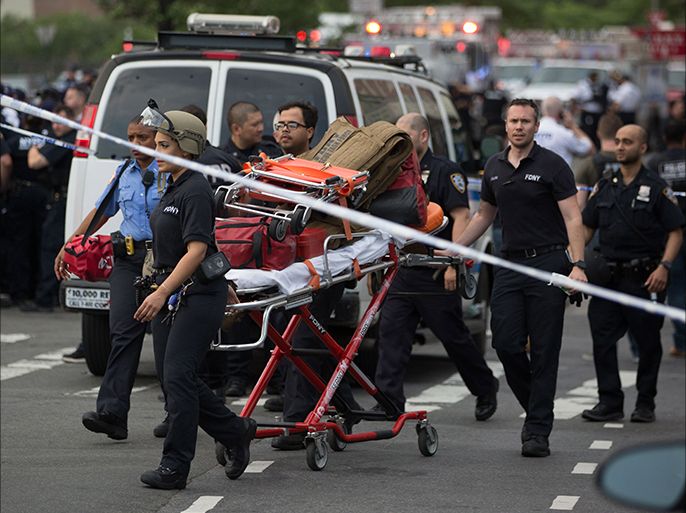 epa06058783 Medics leave the building after a shooter opened fire, killing at least one doctor and shooting six others before committing suicide at the Bronx-Lebanon Hospital Center in the Bronx, New York, USA, 30 June 2017. EPA/Kevin Hagen
