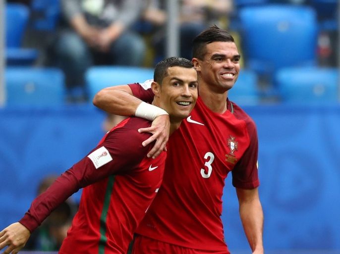 SAINT PETERSBURG, RUSSIA - JUNE 24: Cristiano Ronaldo of Portugal celebrates scoring his sides first goal with Pepe of Portugal during the FIFA Confederations Cup Russia 2017 Group A match between New Zealand and Portugal at Saint Petersburg Stadium on June 24, 2017 in Saint Petersburg, Russia. (Photo by Dean Mouhtaropoulos/Getty Images)