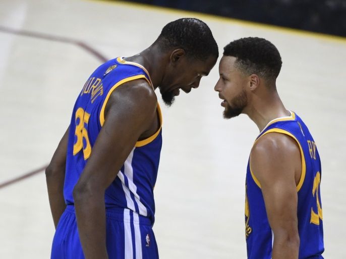 Jun 7, 2017; Cleveland, OH, USA; Golden State Warriors forward Kevin Durant (35, left) celebrates with guard Stephen Curry (30) against the Cleveland Cavaliers during the fourth quarter in game three of the 2017 NBA Finals at Quicken Loans Arena. Mandatory Credit: Kyle Terada-USA TODAY Sports