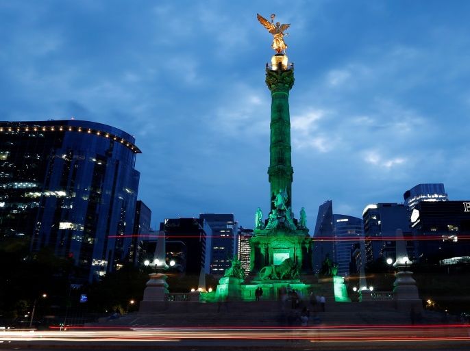 Green lights are projected at the Angel of Independence monument in support in the Paris Climate Agreement, after U.S. President Donald Trump announced his decision that the United States will withdraw from the Paris Agreement in Mexico City, Mexico June 1, 2017. REUTERS/Carlos Jasso