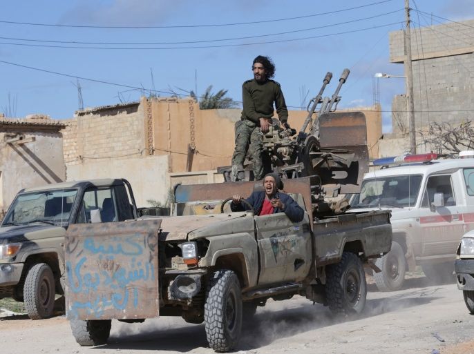 Members of East Libyan forces ride a vehicle after taking control of Ganfouda district in Benghazi, Libya January 26, 2017. REUTERS/Esam Omran Al-Fetori