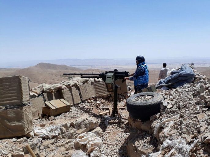 Fighters from the Syrian army units and Hezbollah are seen on the western mountains of Qalamoun, near Damascus, in this handout picture provided by SANA on July 23, 2017, Syria. SANA/Handout via REUTERS ATTENTION EDITORS - THIS PICTURE WAS PROVIDED BY A THIRD PARTY. REUTERS IS UNABLE TO INDEPENDENTLY VERIFY THE AUTHENTICITY, CONTENT, LOCATION OR DATE OF THIS IMAGE.